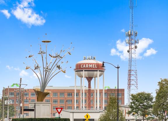 a water tower on top of a building in the city at Providence at Old Meridian Apartments , Carmel, Indiana