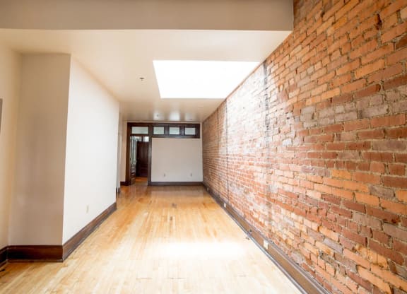 Living Area space with Exposed Brick at Lockerbie Court on Mass Ave, Indianapolis