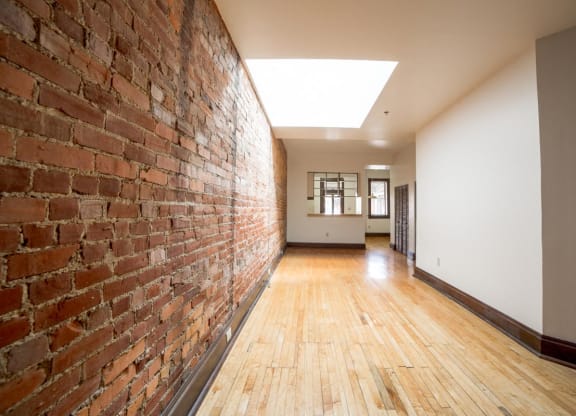 Living Area with Exposed Brick at Lockerbie Court on Mass Ave, Indiana