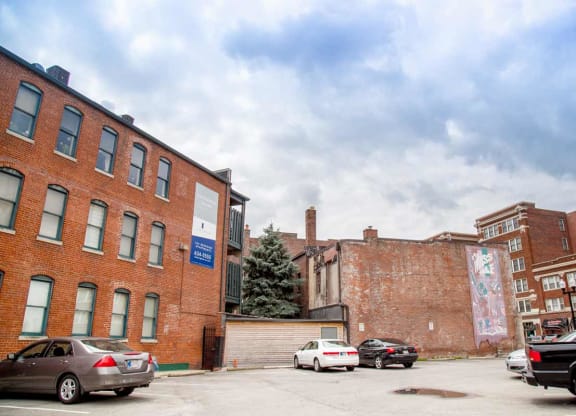 Apartment buildings with parking area at Lockerbie Court on Mass Ave, Indianapolis, IN