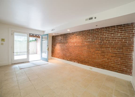 Living Area with Exposed Brick at Lockerbie Court on Mass Ave, Indianapolis