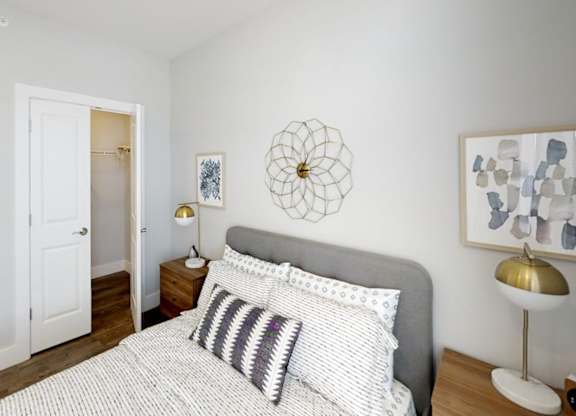 bedroom with white bedding at Echo Park at Perry Crossing Apartments, Plainfield, 46168