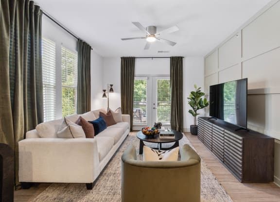 a living room with a couch and a tv