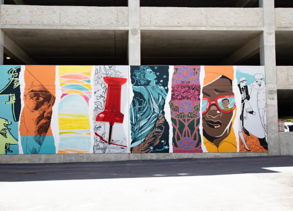 a mural on the side of a building in a parking garage