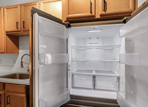 A white refrigerator with its door open in a kitchen.at The Foundry, Indiana