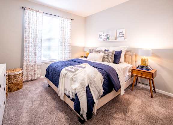 Bedroom with cozy bed and lamp interior at Providence at Old Meridian Apartments , Indiana 46032