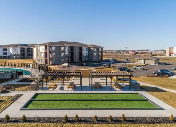 an aerial view of an apartment complex with a pool and grass at Echo Park at Perry Crossing Apartments, Plainfield, IN