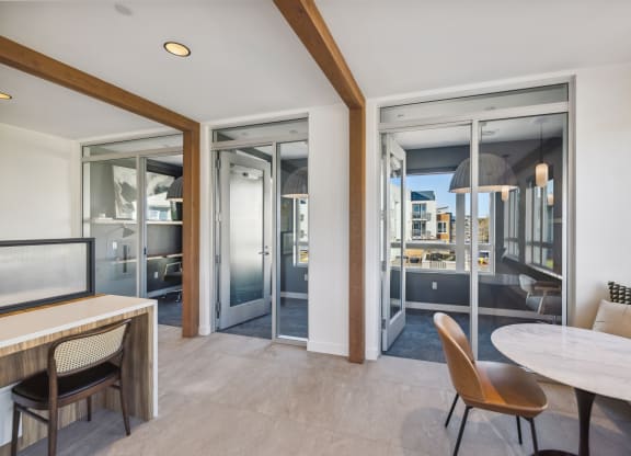 a living room and dining room with sliding glass doors and a view of the city at 38° NORTH, Santa Rosa California 