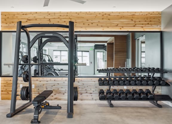 a gym with gym equipment and a wooden wall at 38° NORTH, Santa Rosa, CA 95404