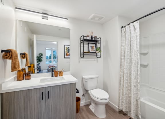 a bathroom with a toilet and a shower and a sink at 38° NORTH, California, 95404