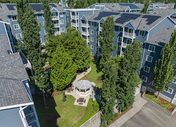 A bird's eye view of a residential area with a gazebo in the center.