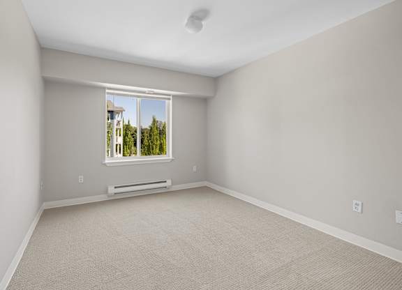 A room with a window and a door.