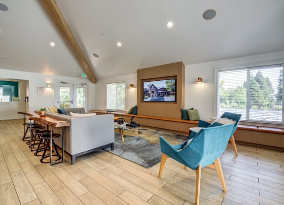 Clubhouse seating by TV at BELLA VISTA AT HILLTOP, Richmond, California