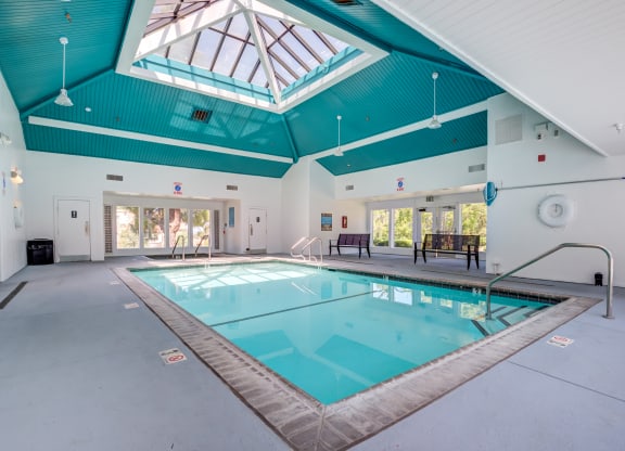 Indoor Pool Surrounded by Two Benches at BELLA VISTA AT HILLTOP, California, 94806