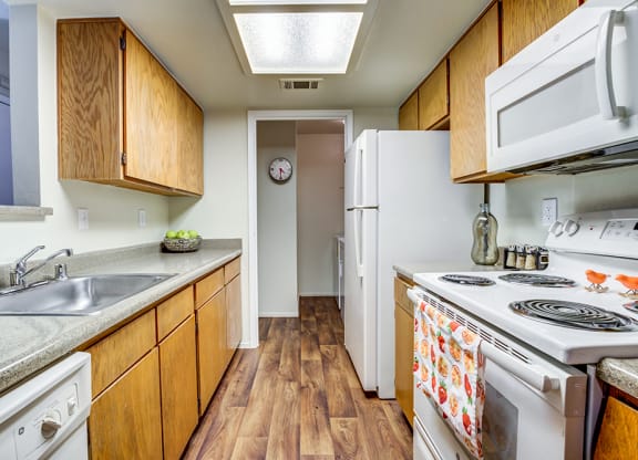 Kitchen with appliance and view to hall at BELLA VISTA AT HILLTOP, Richmond, 94806