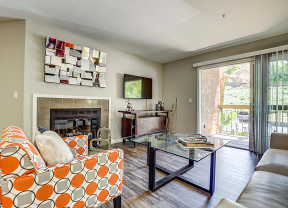 Living Room with fireplace and patio at BELLA VISTA AT HILLTOP, Richmond, 94806