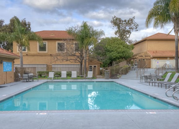 Pool with lounge chairs Home Rentals in Richmond CA at Bella Vista at Hilltop
