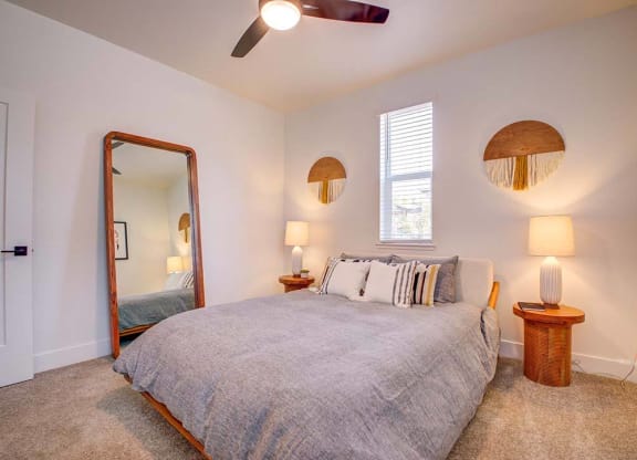 a bedroom with a bed and a mirror at 38° NORTH, Santa Rosa, CA 95404