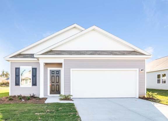 a white house with a white garage door