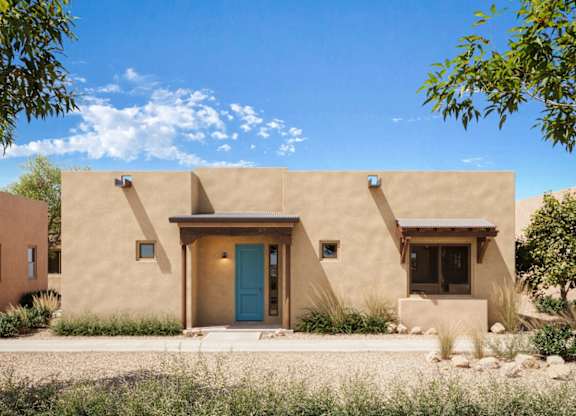 A beige house with a blue door and windows.