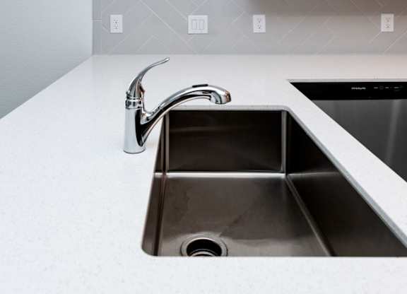 a kitchen sink with a faucet