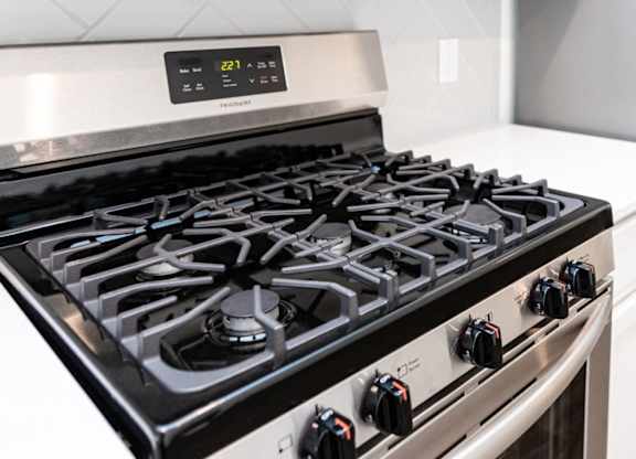 a black and silver stove top oven in a kitchen