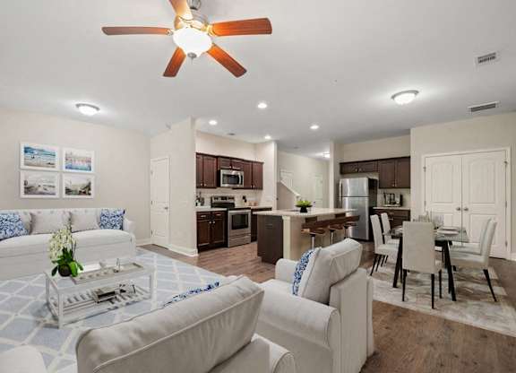 Omnia at Richmond Hill Townhomes in Georgia photo of a living room and kitchen.