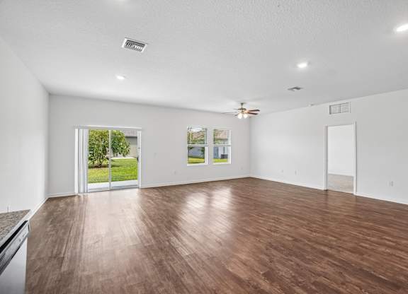 A room with wooden floors and white walls.