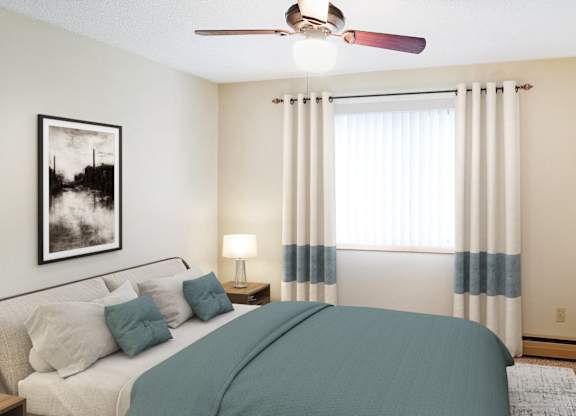 A bedroom with a bed, nightstand, and a ceiling fan.