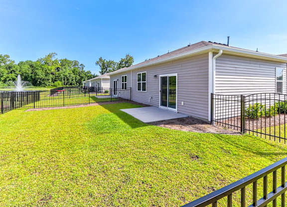 a 3d rendering of a house with a green fence