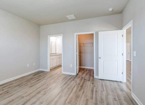 a renovated living room with white walls and wood floors