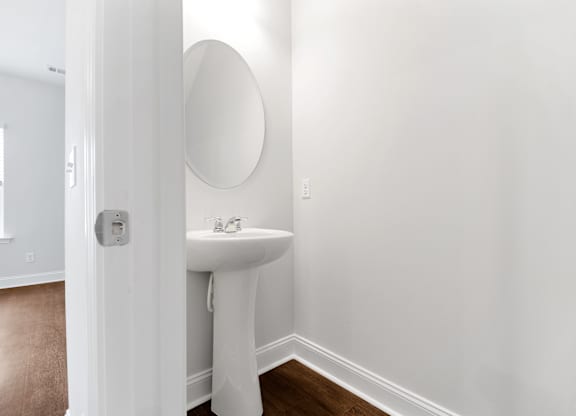 Cottonvale Towns in Savannah, GA photo of half bath with sink and mirror