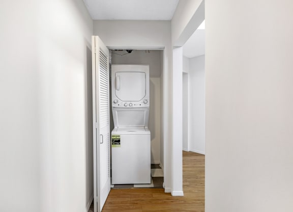 a room with a washer and dryer in it