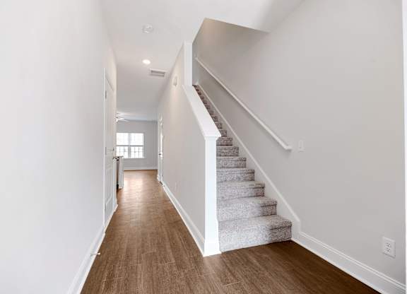 Cottonvale Towns in Savannah, GA photo of hallway with staircase leading to second floor