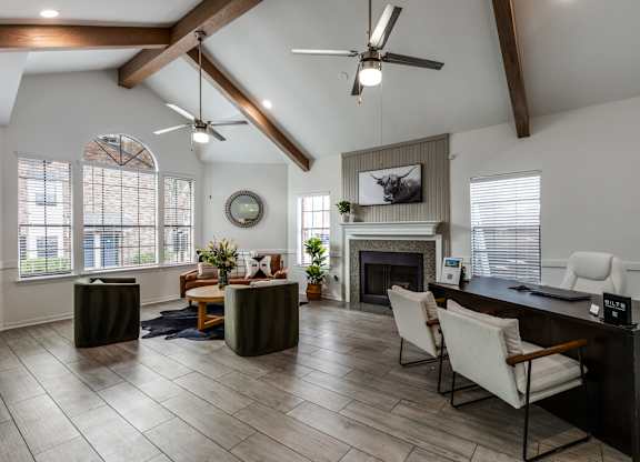 A modern living room with a fireplace and a television.