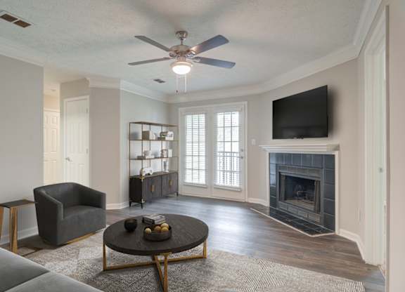 Living room with fireplace at Place at Midway apartments in Douglasville near Lithia Springs, GA