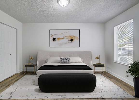 Renovated primary bedroom at Chelsea Apartments in Gainesville, Florida