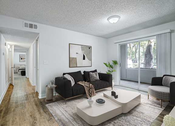 Spacious living room in renovated apartment at Chelsea Apartments in Gainesville FL, pet-friendly community