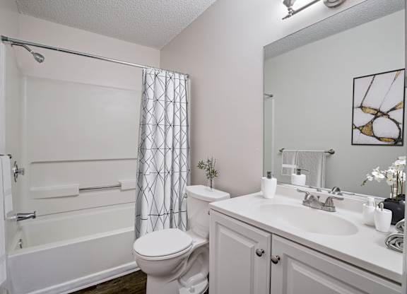 Renovated bathroom with modern finishes at Chelsea Apartments in Gainesville, Florida