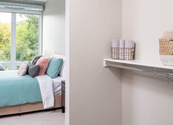 a bedroom with a bed and a window