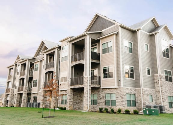 a large apartment building with balconies on the side of it