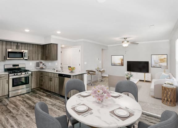 a kitchen and dining room with a table and chairs