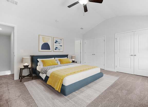Cottonvale Towns in Savannah, GA photo of a bedroom with a bed and a ceiling fan