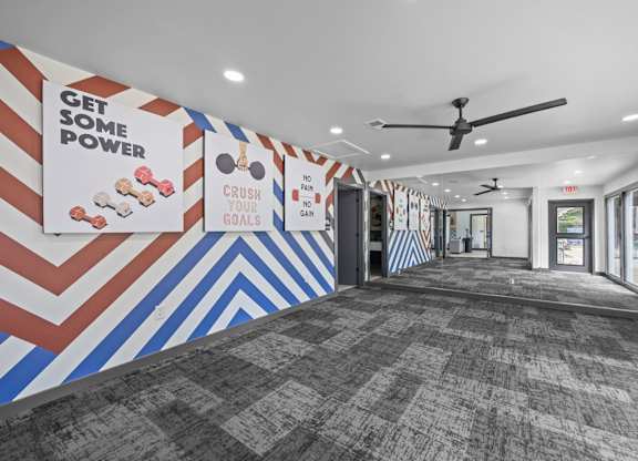 A hallway with a motivational poster on the wall.