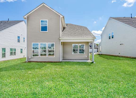 Fountain Inn, SC Houses For Rent - Pine Ridge Place - Back Yard Of House Surrounded By Lush Grass And Houses Side By Side