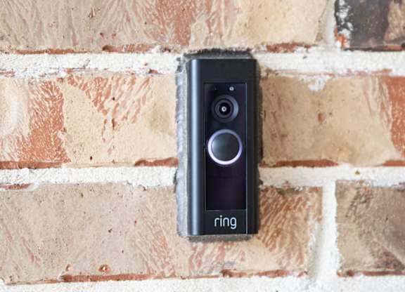 a ring video doorbell mounted on a brick wall