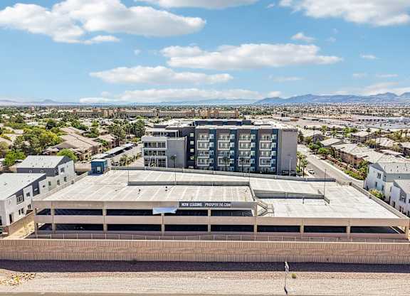 A large building with a flat roof and a sign that reads
