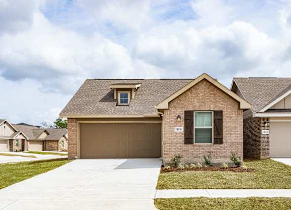 a home with a brown garage door