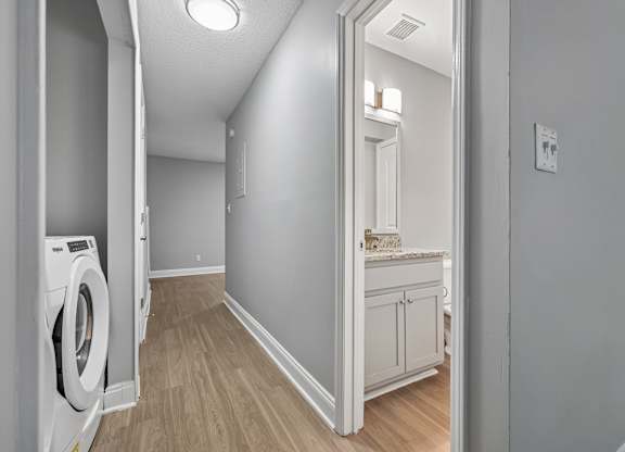 A laundry room with a washer and dryer.