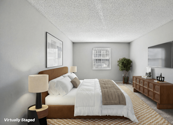 A bedroom with a bed, nightstand, and lamp.